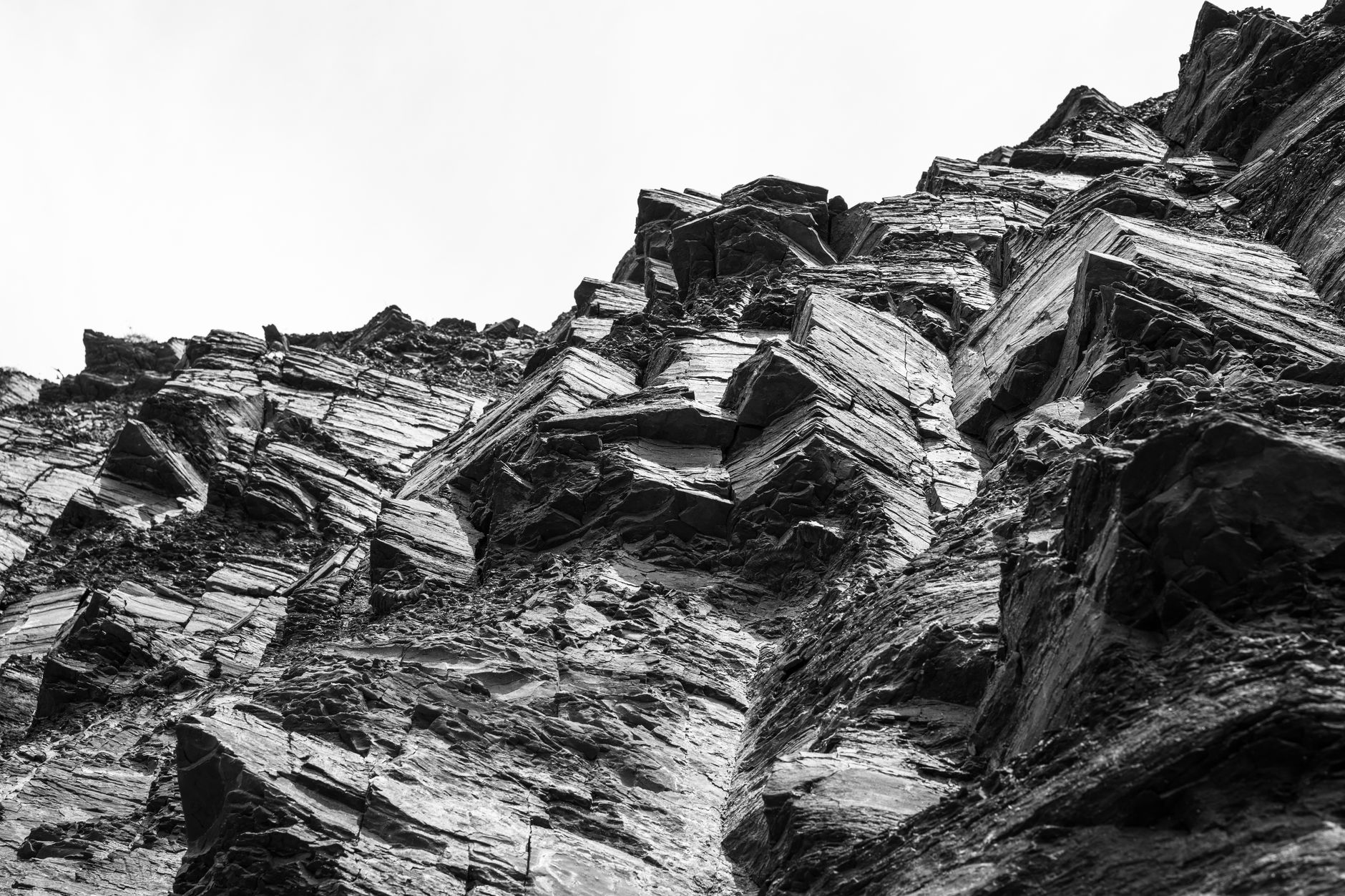Stunning black and white photograph of eroded rock formations showcasing natural geological textures.