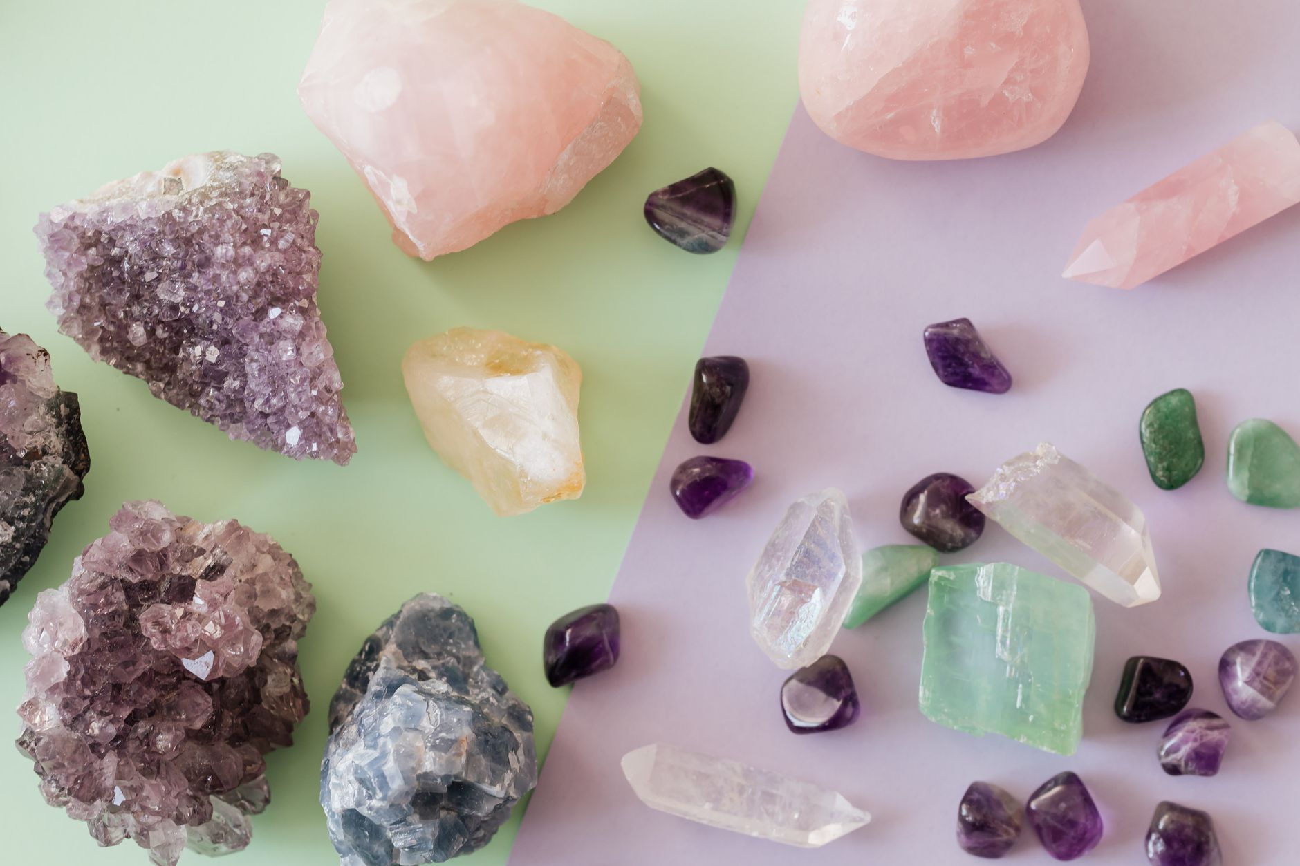 various rough gemstones and crystals laid out for identification