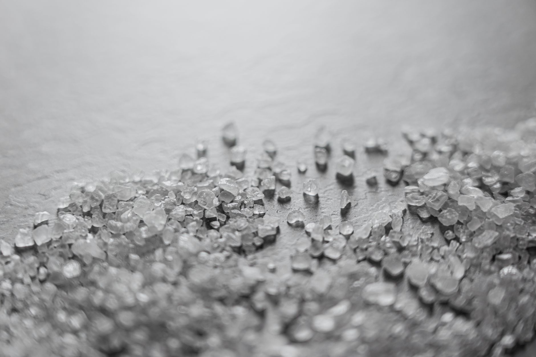 coarse silicon carbide grit poured into a rotary rock tumbler barrel