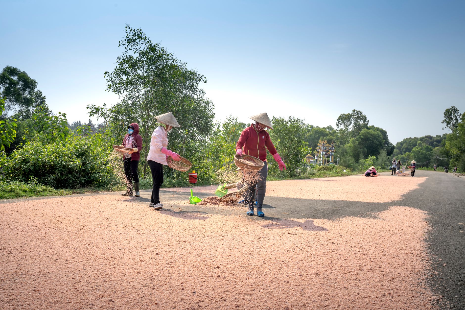 visitors sifting gravel and inspecting stones at a North Carolina gem mine sluice